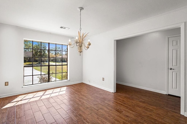 unfurnished dining area featuring dark wood-type flooring, visible vents, a notable chandelier, and baseboards