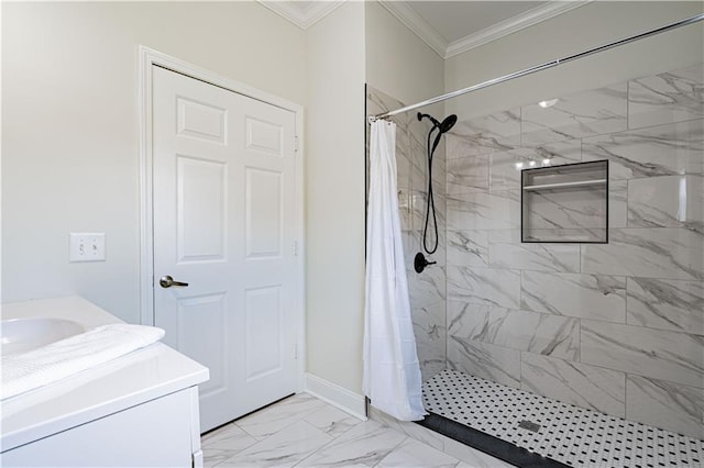 bathroom with baseboards, ornamental molding, marble finish floor, a tile shower, and vanity