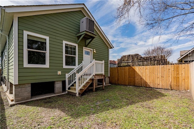 rear view of house with fence