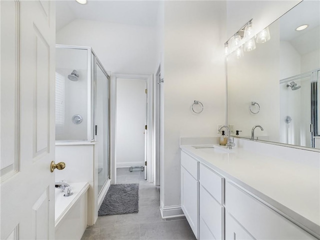 bathroom with lofted ceiling, a stall shower, vanity, and a bath