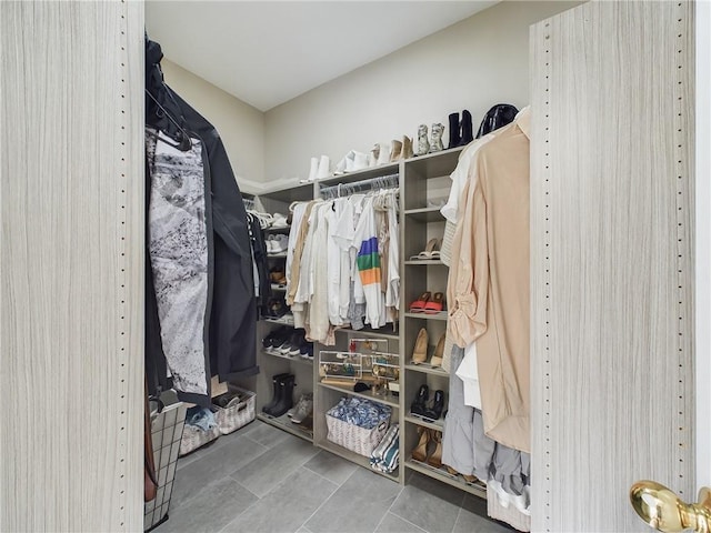 spacious closet featuring tile patterned flooring