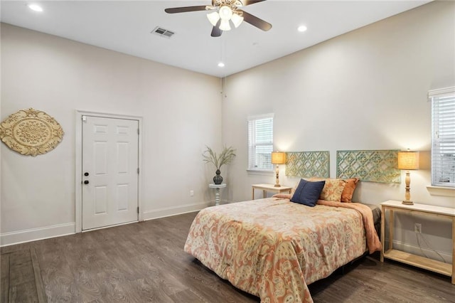 bedroom featuring recessed lighting, visible vents, baseboards, and wood finished floors