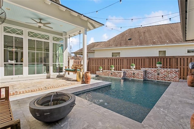 view of pool featuring a fire pit, a patio area, fence, and a fenced in pool