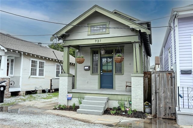 shotgun-style home with a porch