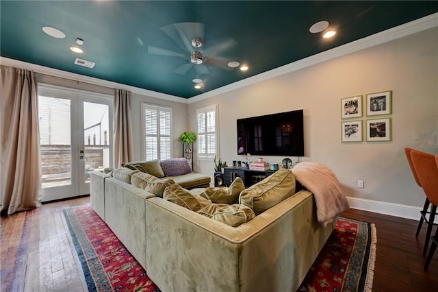 living room with visible vents, baseboards, french doors, ornamental molding, and wood-type flooring