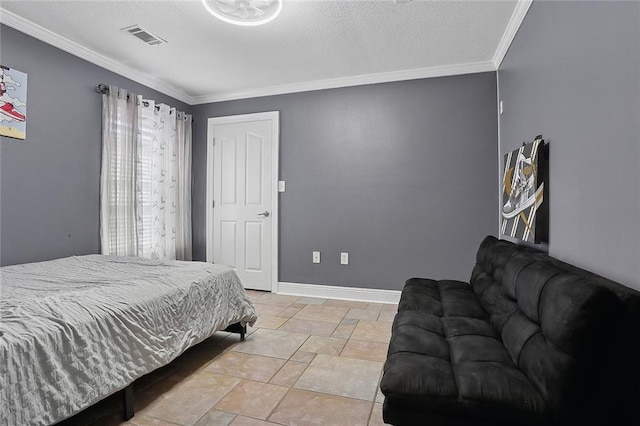 bedroom with baseboards, visible vents, and crown molding