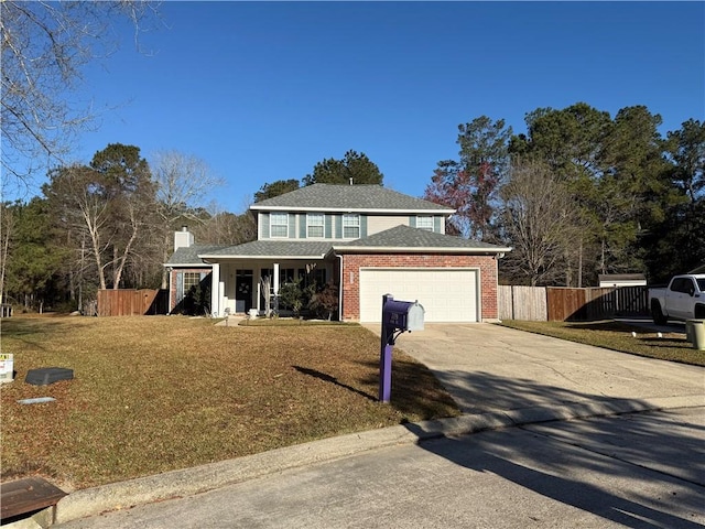 traditional home with fence, an attached garage, concrete driveway, brick siding, and a front lawn