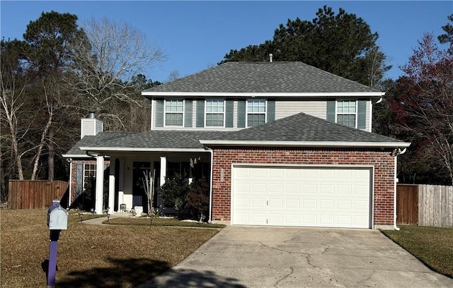 traditional home with an attached garage, driveway, fence, and roof with shingles