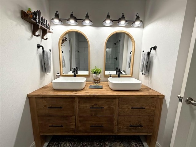 bathroom with double vanity and a sink