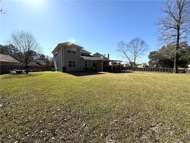 view of yard with a fenced backyard and a patio