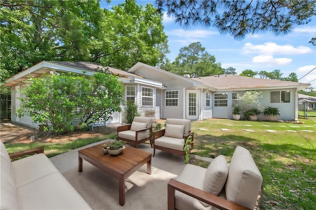 back of property with a yard, a patio, and an outdoor hangout area