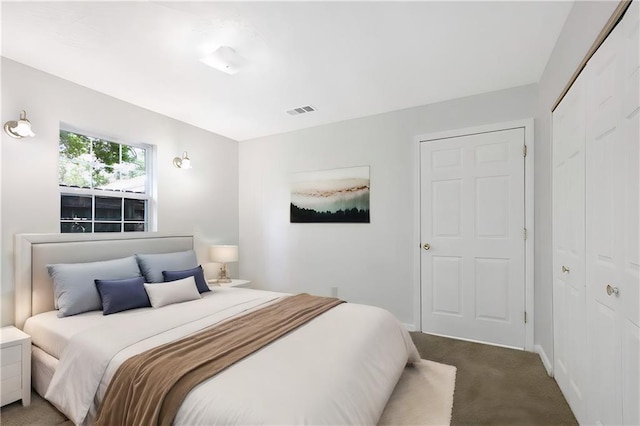 bedroom with carpet, a closet, and visible vents