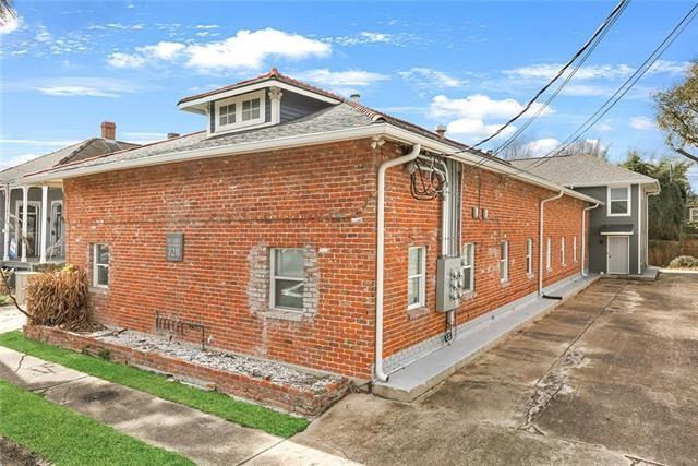 view of property exterior featuring brick siding