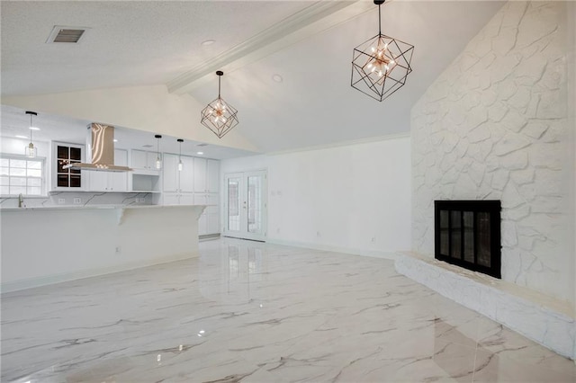 unfurnished living room with baseboards, visible vents, a stone fireplace, vaulted ceiling with beams, and french doors