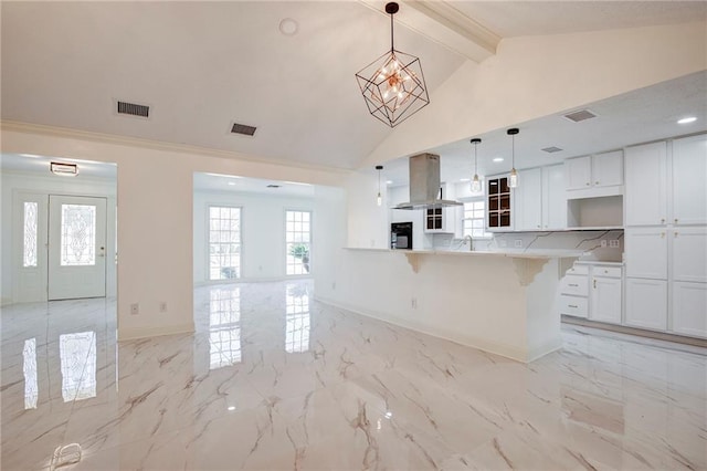 kitchen with marble finish floor, visible vents, and island range hood