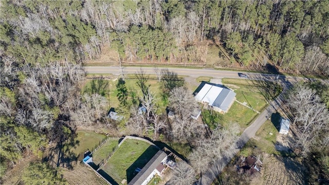 aerial view featuring a wooded view