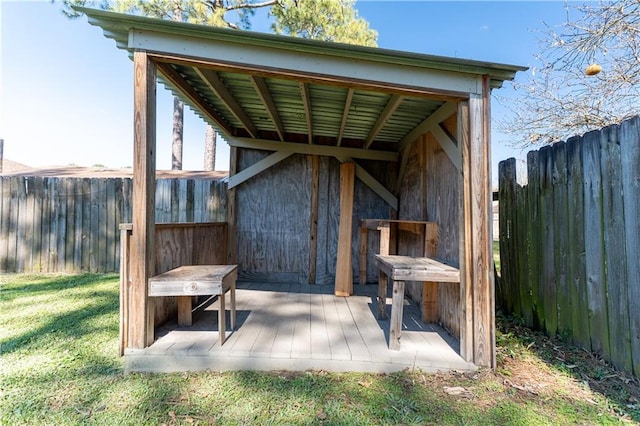 wooden deck with a yard and fence