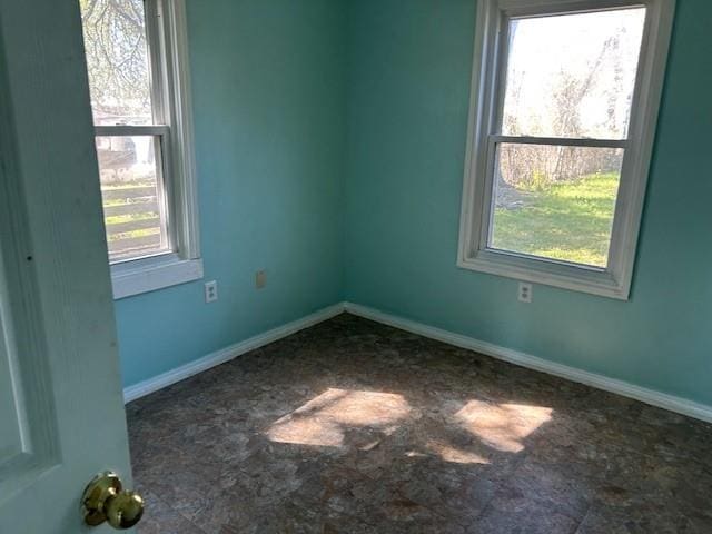 empty room with baseboards