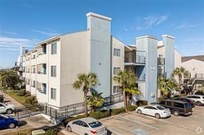 view of building exterior featuring uncovered parking