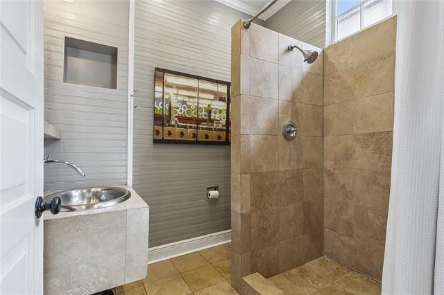 741 Esplanade Ave Unit 5, New Orleans, LA 70116 - full bathroom with a sink, a tile shower, and tile patterned floors