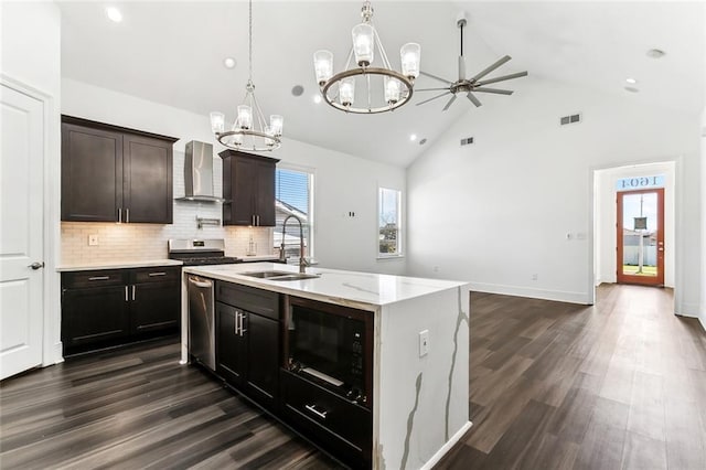 kitchen with black microwave, a sink, visible vents, stainless steel dishwasher, and wall chimney range hood