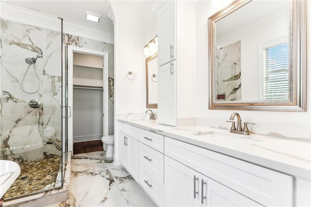 bathroom featuring a sink, double vanity, a marble finish shower, and crown molding