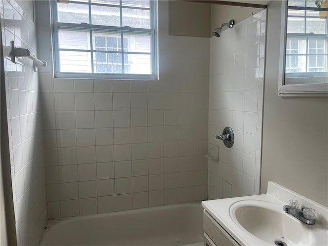 bathroom featuring shower / bathing tub combination and vanity