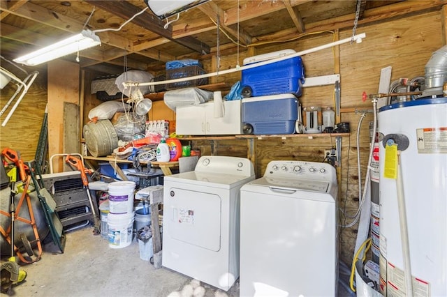 laundry room featuring water heater, laundry area, and washer and dryer