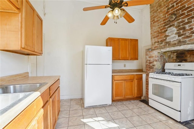 kitchen featuring light tile patterned floors, white appliances, light countertops, and a ceiling fan