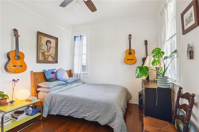 bedroom with wood finished floors and ceiling fan