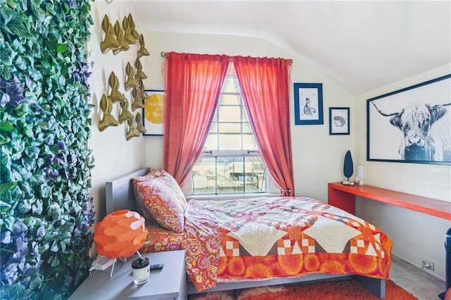 bedroom with lofted ceiling, multiple windows, and carpet