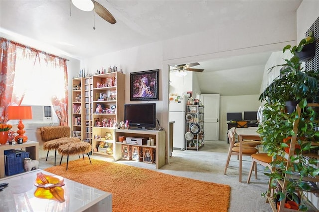 carpeted living room with ceiling fan