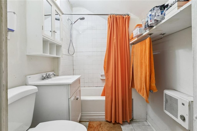 bathroom with tile patterned floors, shower / bath combo with shower curtain, toilet, and vanity