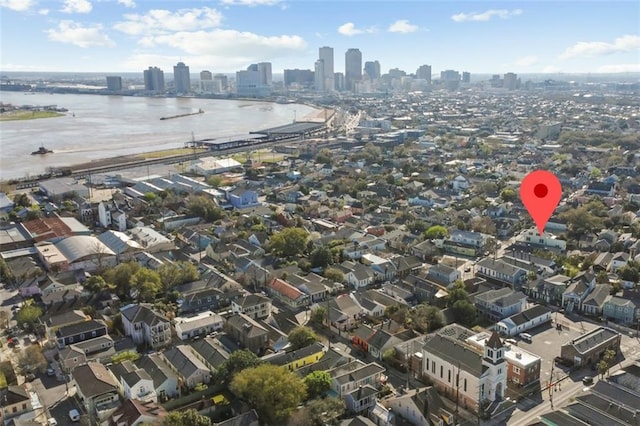 aerial view featuring a view of city and a water view