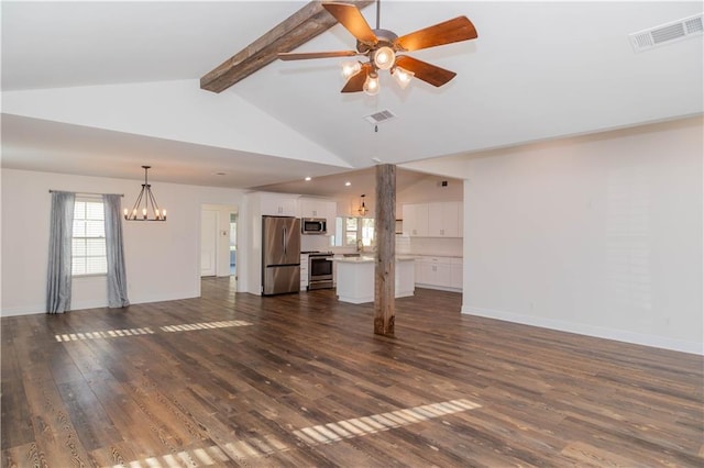 119 Ivy Dr, Covington, LA 70433 - unfurnished living room featuring ceiling fan with notable chandelier, visible vents, dark wood-type flooring, and beamed ceiling