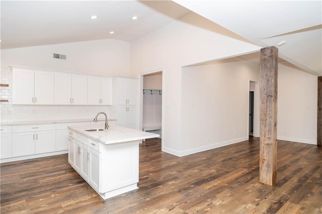 119 Ivy Dr, Covington, LA 70433 - kitchen featuring lofted ceiling, dark wood-style floors, a sink, and white cabinets