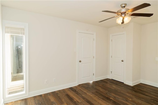 119 Ivy Dr, Covington, LA 70433 - unfurnished bedroom with baseboards, dark wood-style floors, and ceiling fan