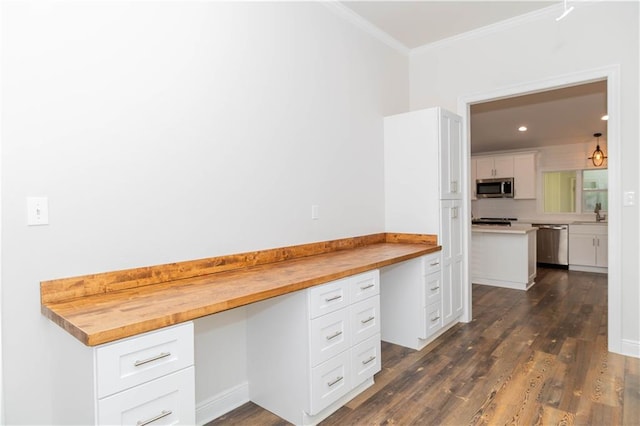 119 Ivy Dr, Covington, LA 70433 - unfurnished office featuring built in desk, dark wood-style flooring, recessed lighting, and crown molding