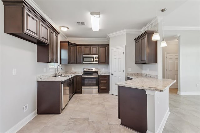 kitchen with a peninsula, a sink, visible vents, dark brown cabinets, and appliances with stainless steel finishes