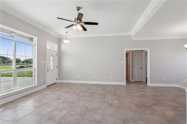 empty room with ceiling fan, baseboards, crown molding, and light tile patterned flooring