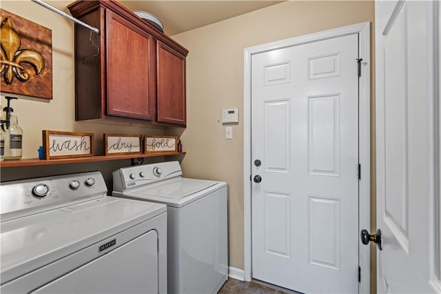 clothes washing area with cabinet space, independent washer and dryer, and baseboards