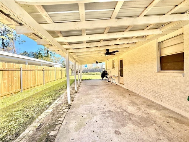 view of patio with fence and ceiling fan