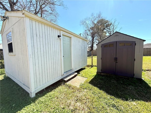 view of shed featuring fence