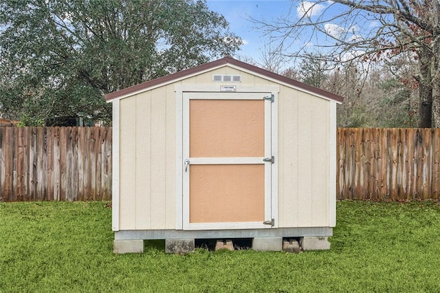 view of shed featuring a fenced backyard