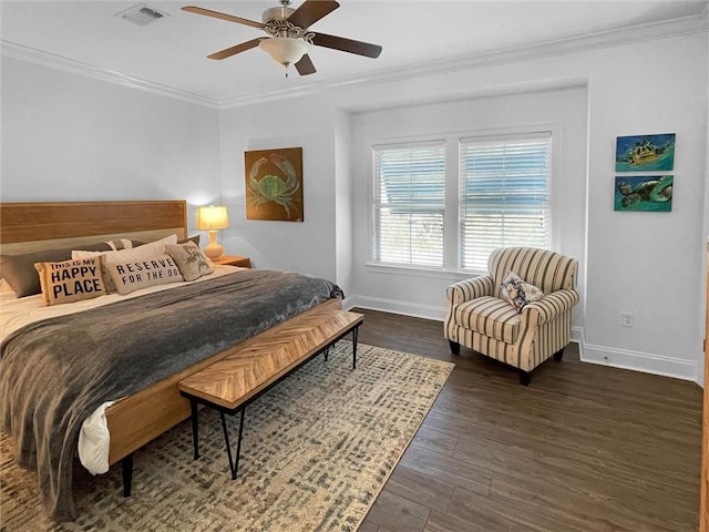 bedroom with baseboards, dark wood-style flooring, visible vents, and crown molding