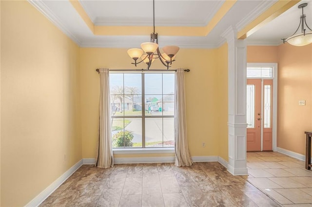 unfurnished dining area with an inviting chandelier, baseboards, and a tray ceiling