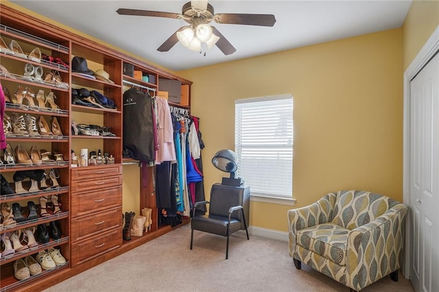 spacious closet with carpet and a ceiling fan