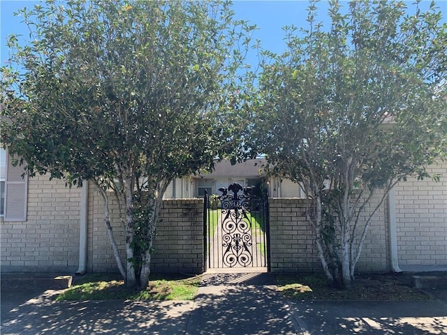 view of gate with fence