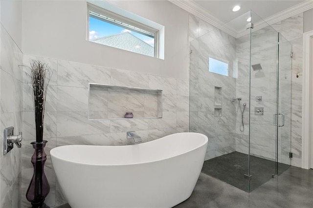 bathroom with tile walls, ornamental molding, a stall shower, a freestanding bath, and recessed lighting