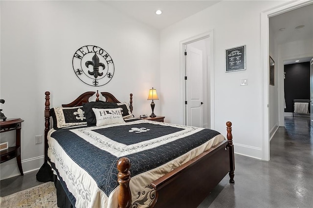bedroom featuring baseboards, concrete flooring, and recessed lighting